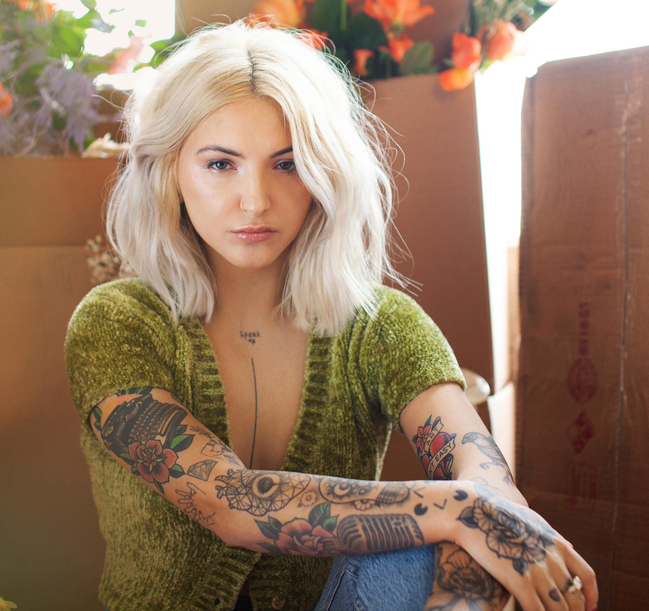 julia michaels staring sitting green sweater