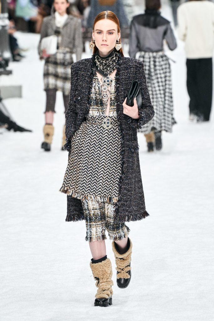 Chanel 2019 Runway Model Wearing Multiple Tweed Black and White Patterns and Lambswool and Leather Chunky Boots