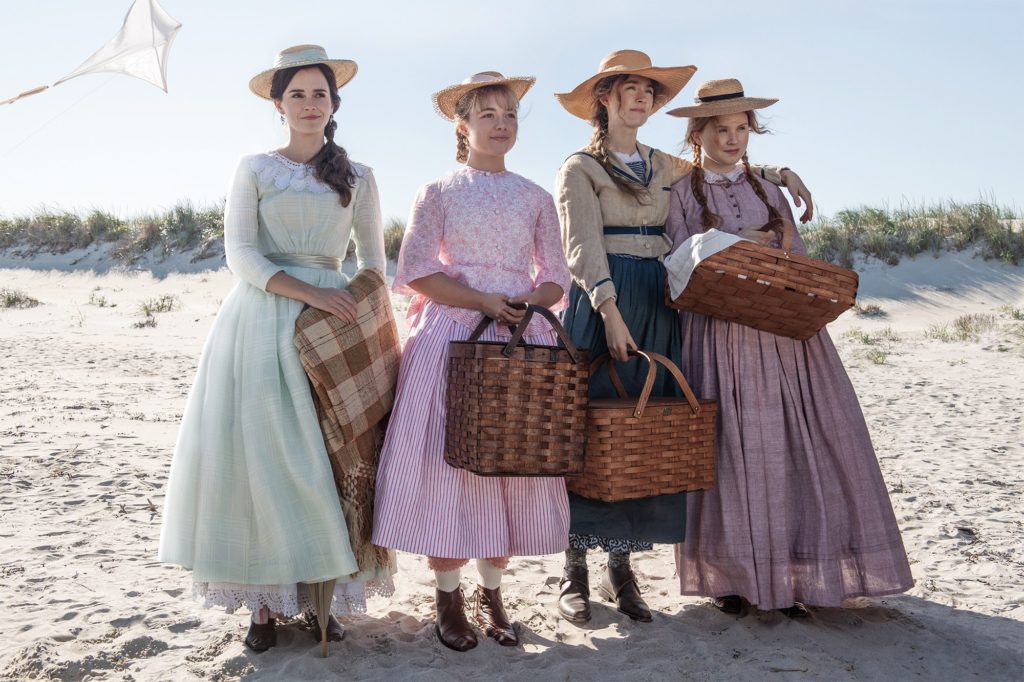 he March Sisters on the beach wearing hand made dresses worn during the Civil War period from a scene in Little Women