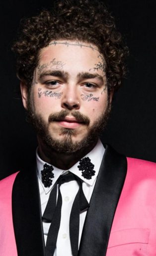Post Malone in Pink Tuxedo with Black lapels-white shirt and skinny black cowboy tie