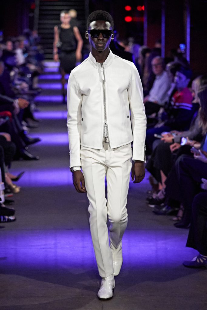 Tom Ford SS Runway 2020 Model Wearing All White from leather jacket-white pants and white patent leather Beatle boots