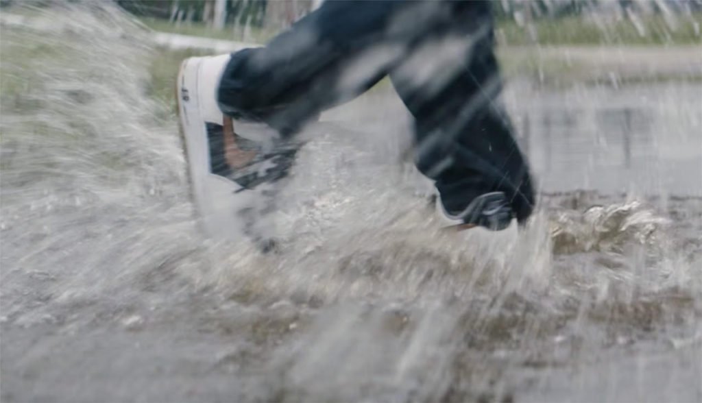 Cameron dancing in puddles