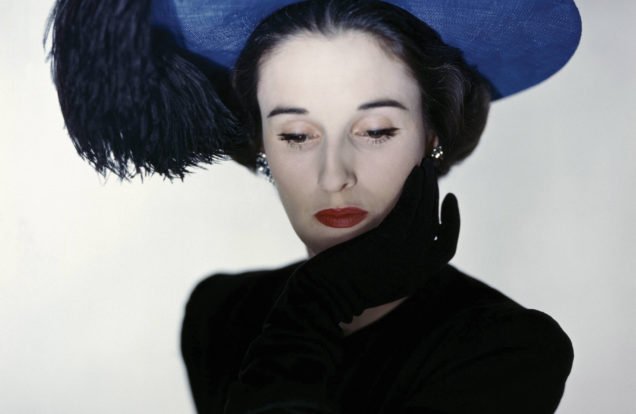 Miss Cushing Mortimer wearing a blue hat with plumes of feathers. (Photo by Erwin Blumenfeld/Condé Nast via Getty Images)