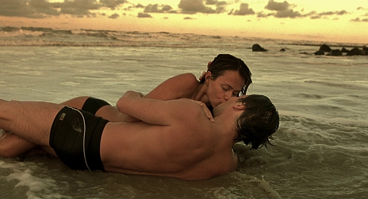 Couple kissing on the beach in the diving bell and the butterfly