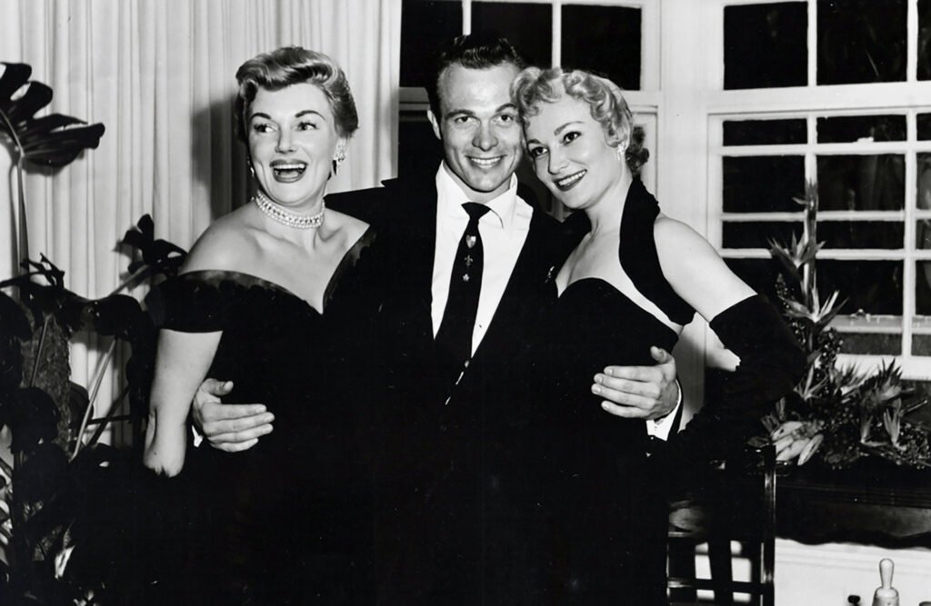 Scotty Bowers embraced by actresses
