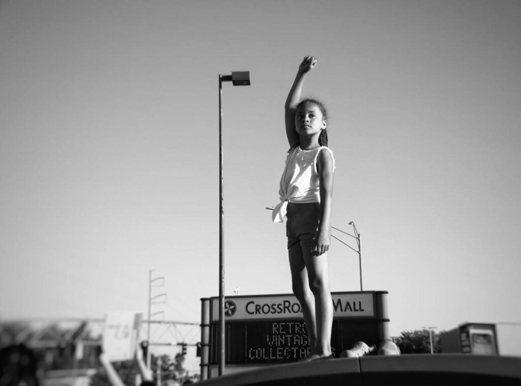 7-year-old girl demonstrating in Omaha tweeted by Kamala Harris