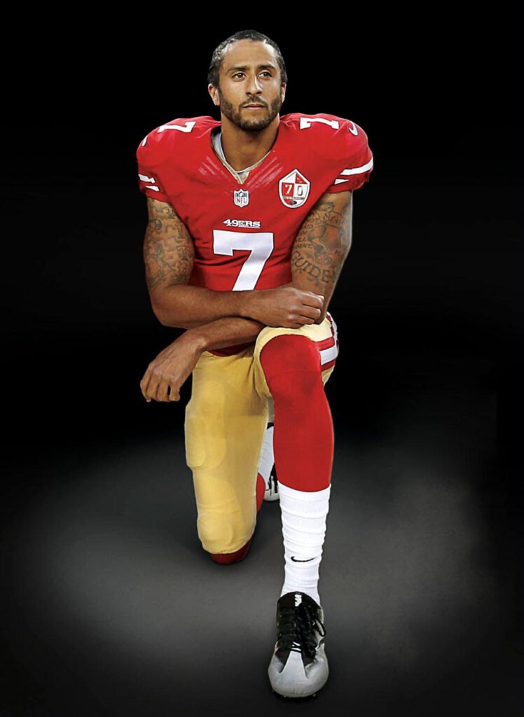 Colin Kaepernick takes a knee
