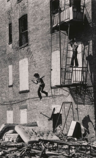 Martha Cooper Lower East Side [Boy Jumping from Fire Escape], 1978
