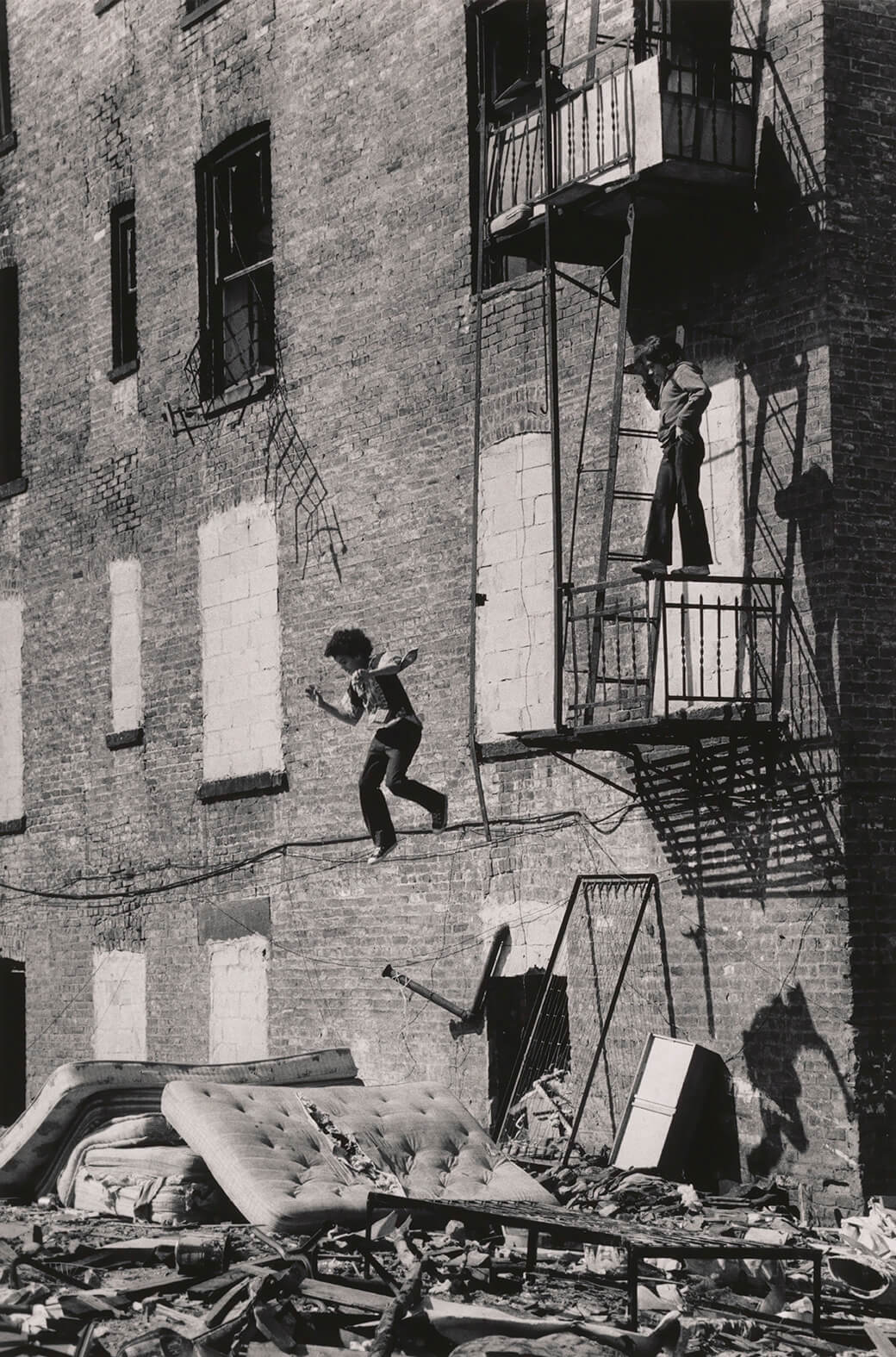 Martha Cooper Lower East Side [Boy Jumping from Fire Escape], 1978