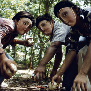 Susan Meiselas, Youths practice throwing contact bombs in forest surrounding Monimbo, 1978; printed later. Inkjet print on mesh. 26 1⁄2 x 39 3⁄4 in. Courtesy the artist. © Susan Meiselas/Magnum Photos