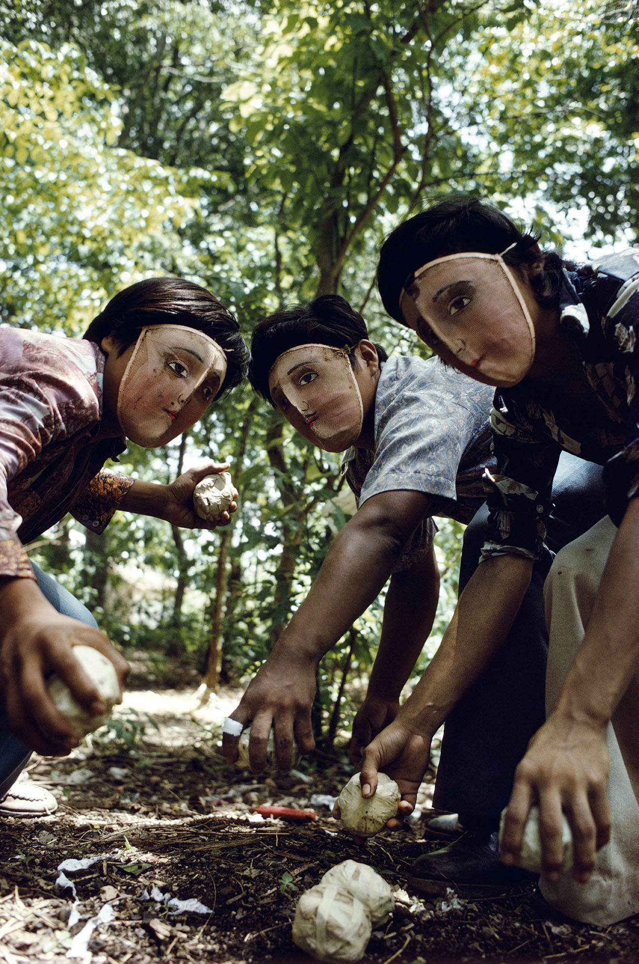 Susan Meiselas, Youths practice throwing contact bombs in forest surrounding Monimbo, 1978; printed later. Inkjet print on mesh. 26 1⁄2 x 39 3⁄4 in. Courtesy the artist. © Susan Meiselas/Magnum Photos