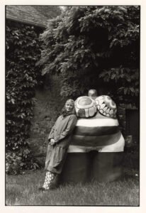 Niki with “Clarice Again” at her front garden, outside of Paris, France. 1981. Gelatin Silver Print. 12 3/16 x 8 ¼” (31 x 21 cm). Photo: Michiko Matsumoto © Michiko Matsumoto