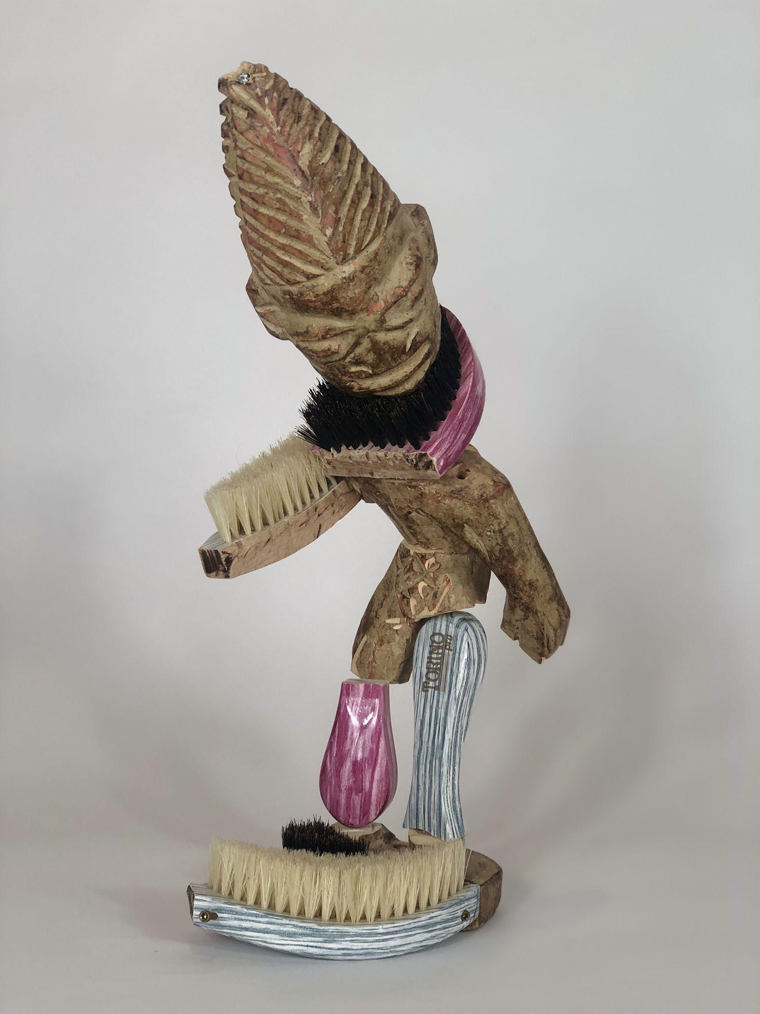 Anthony Olubunmi Akinbola, Chopped and Screwed #01, 2019; Ibejii, wave brush, and screws; 14 3/4 x 9 3/8 x 2 1/4 in. Courtesy of the artist. Photo: Anthony Akinbola.