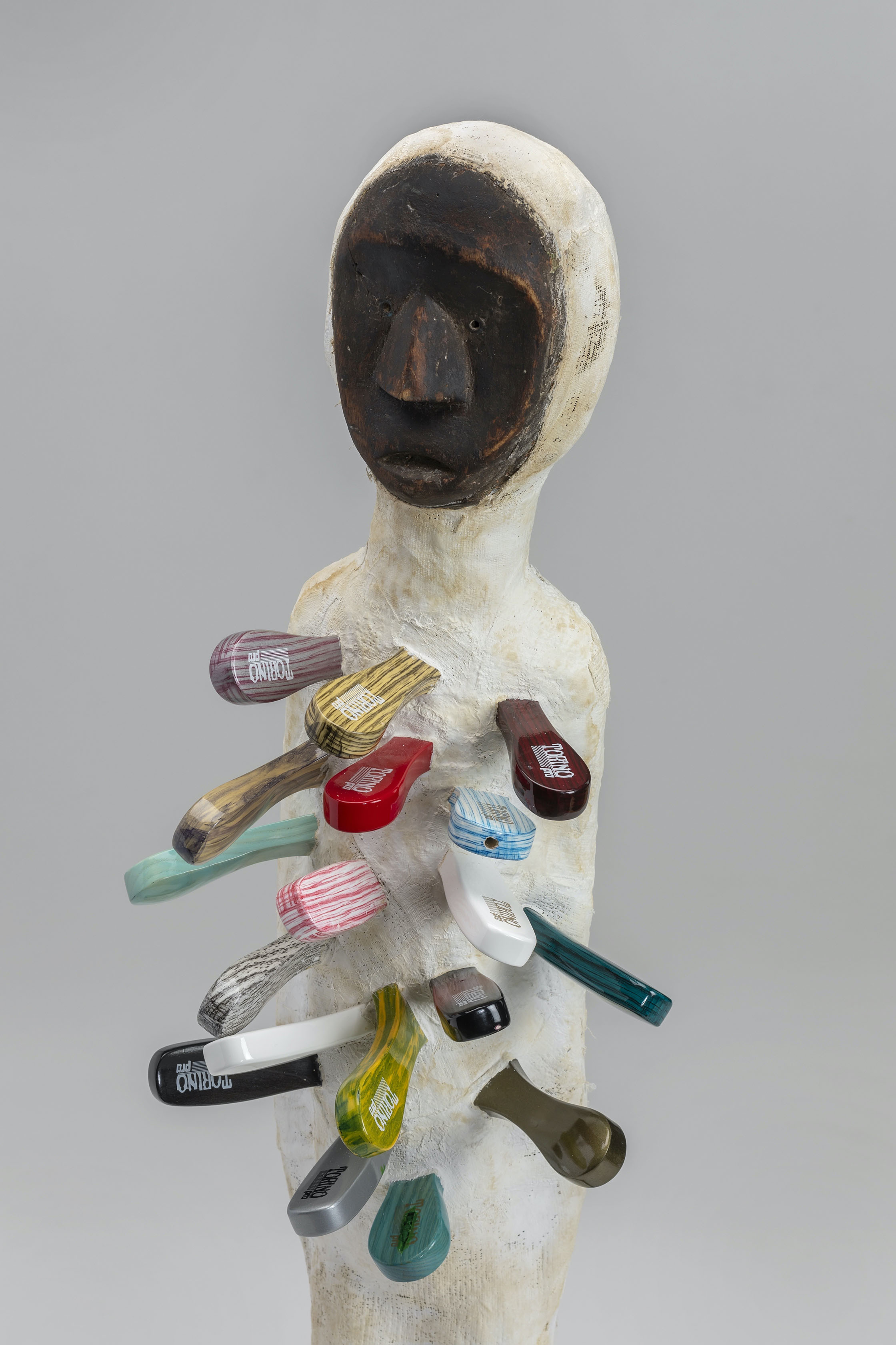 Anthony Olubunmi Akinbola, No Weapon Fashioned (detail), 2021; wood, hairbrushes, and linen; 35 3/4 x 7 x 10 in. Courtesy of the artist. Photo courtesy of John Michael Kohler Arts Center.