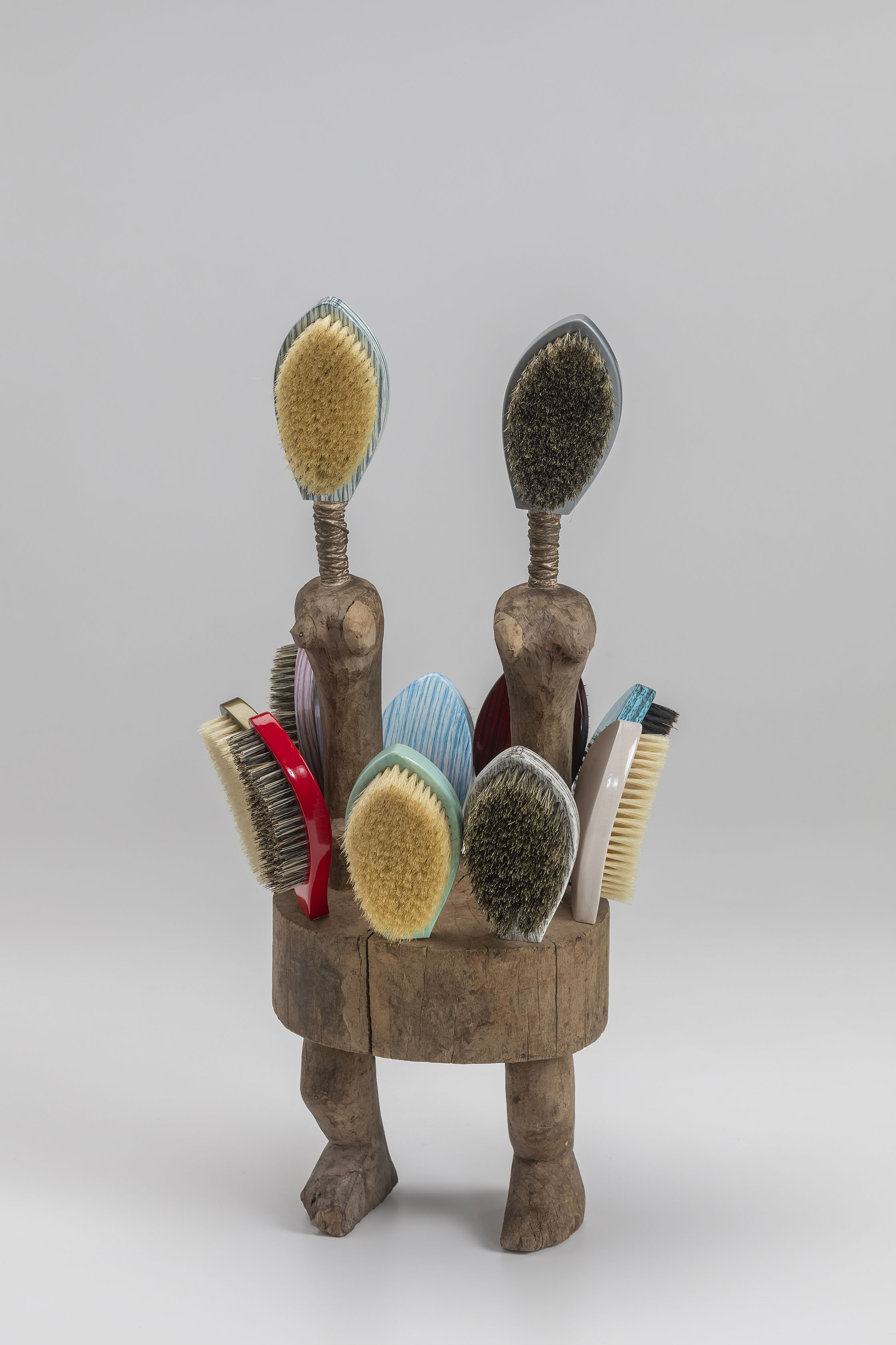 Anthony Olubunmi Akinbola, Back to Sender, 2021; wood and hairbrushes; 25 x 12 3/4 x 10 in. Courtesy of the artist. Photo courtesy of John Michael Kohler Arts Center.