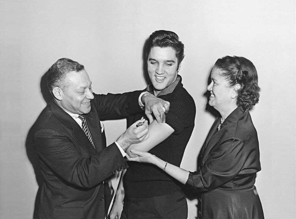 Elvis Presley receiving his polio vaccine backstage at The Ed Sullivan Show