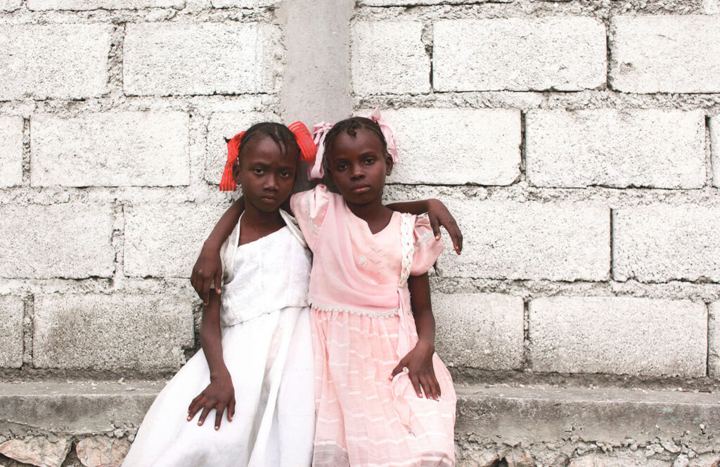 EARTHQUAKE ORPHANS: Orphans of the January 12th earthquake are gathered in a field next to Lycee Jacques, a primary school. They are under the care of FRADES, a grass roots organization which is providing foster care, Croix Des Bouquets, Haiti, 2010 shot by Ozier Mohammad