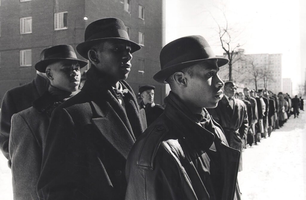 FRUIT OF ISLAM CONFRONTS GANG VIOLENCE: Before breaking up into small groups, this gathering of Muslims from the Nation of Islam receives instructions before talking to young people in this public housing community in Chicago shot by Ozier Muhammad