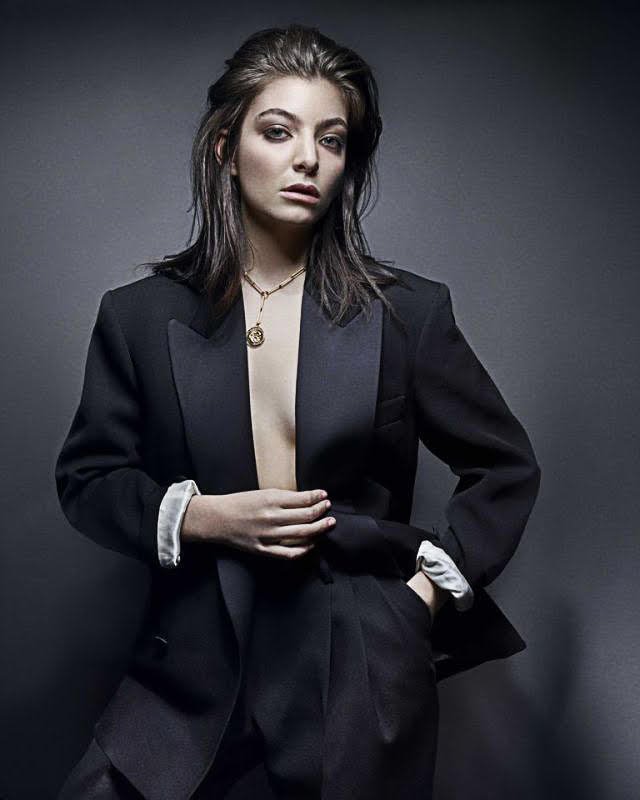 Lorde in sexy tuxedo and slicked back hair