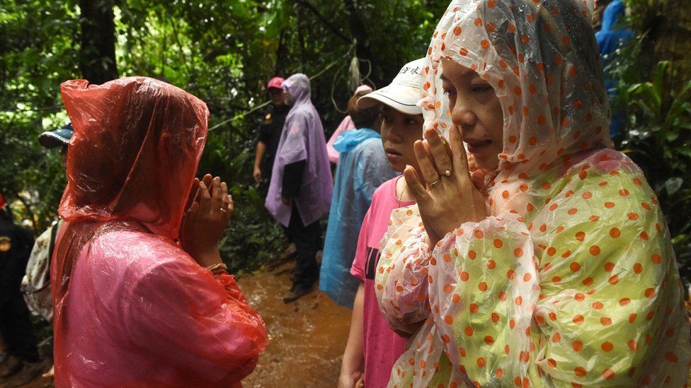 Thai Soccer Mothers Praying at Thai Cave