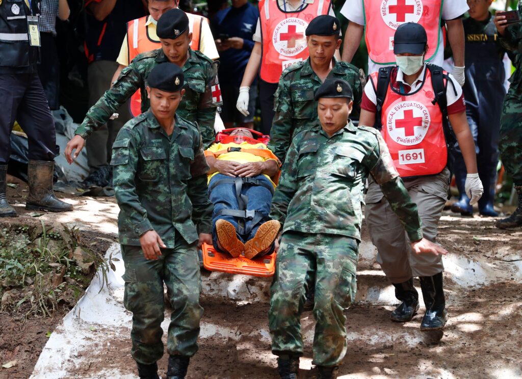 Thai army medics carry stretcher with an acting injured person during a drill Photo by RUNGROJ YONGRIT/EPA-EFE/REX/Shutterstock (9734979q) Thai army medics carry stretcher with an acting injured person during a drill during the ongoing rescue operations for the child soccer team and their assistant coach, at Tham Luang cave in Khun Nam Nang Non Forest Park, Chiang Rai province, Thailand, 04 July 2018. Rescuers are bringing supplies and foods into the cave, where the missing 12 boys and their assistant coach remain, as efforts to drain the cave have not been successful due to rainy weather. Operations are underway to safely bring out the youth soccer team out of the cave. Twelve members of a youth soccer team and their assistant coach have been trapped in Tham Luang cave since 23 June 2018. Missing members of Thai youth soccer team found alive in cave, Chiang Rai, Thailand - 04 Jul 2018