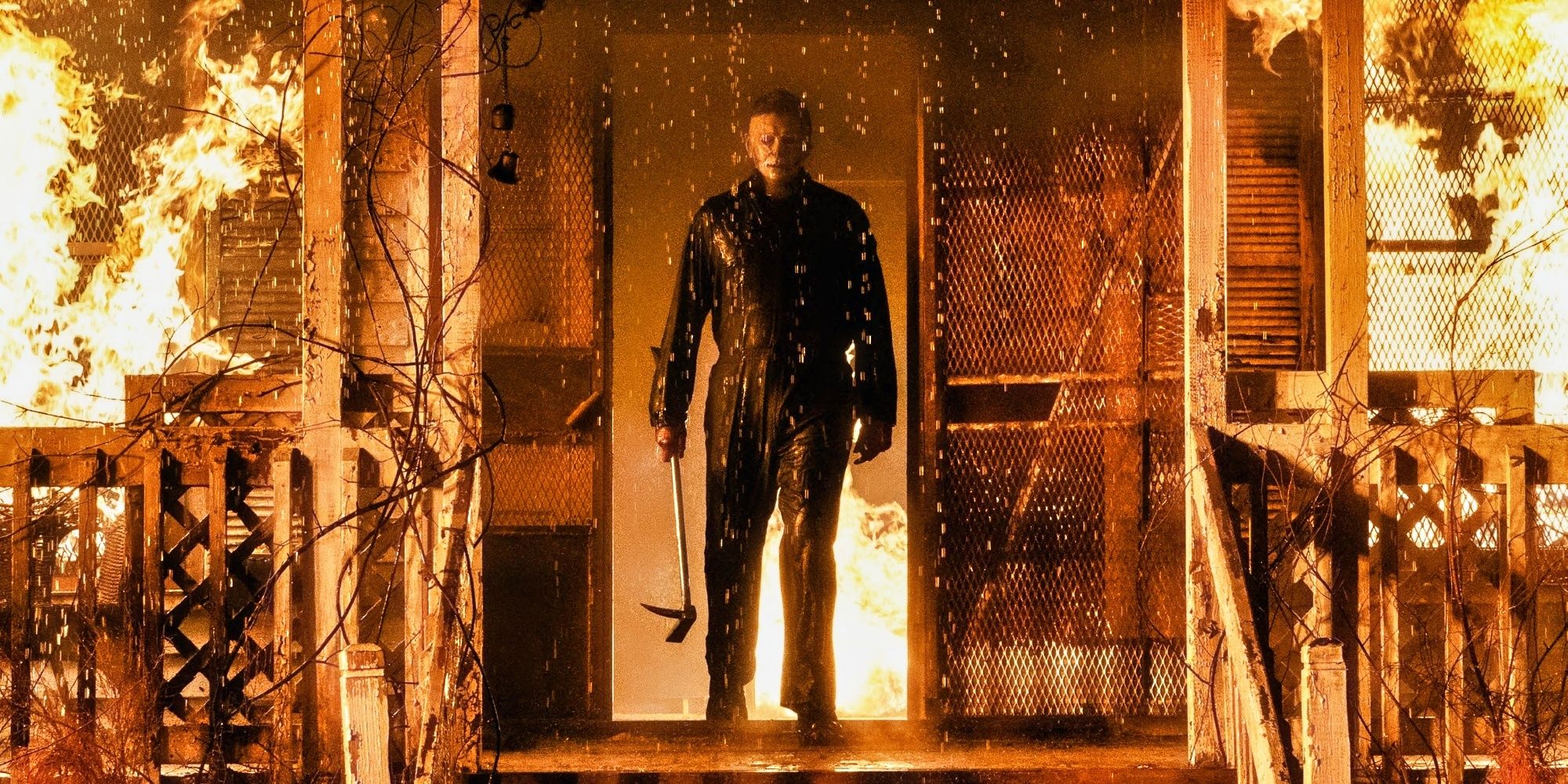 HALLOWEEN KILLS EVIL MAN IN THE DOOR FRAME OF A HOUSE ON FIRE WITH AN AX