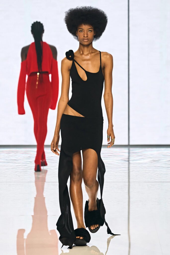 Paris Fashion Week Balmain Runway Model with Afro and sexy Black cut out top