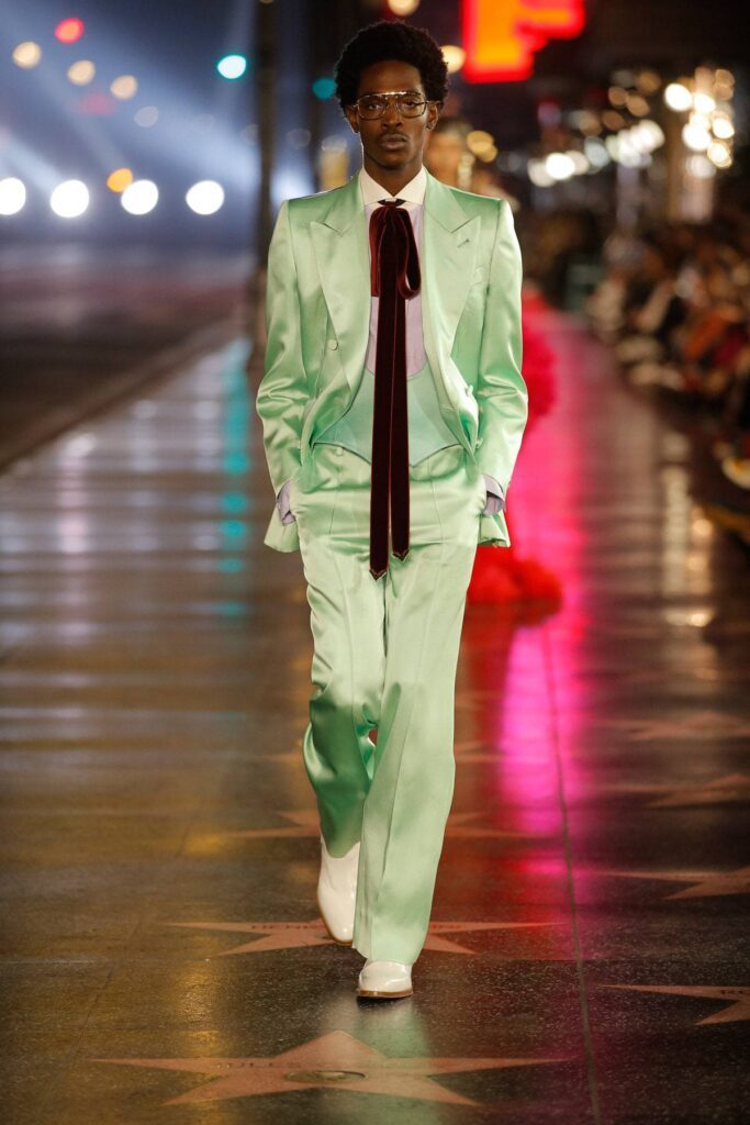 Gucci Male Model Walking Runway in Lime Green Silk Suit and Long Red Tie Gucci Parade