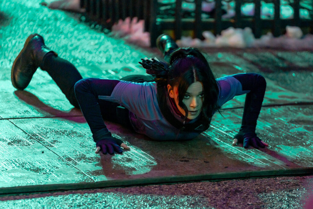 Hailee Steinfeld as Kate Bishop in a Hawkeye scene on all fours on a roof top in NYC