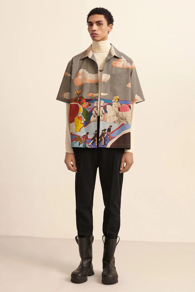 Stella_McCartney_Capsule _Beatles Collection_Model Wearing Light Brown Short Sleeve Shirt with Printed Scene from the Yellow Submarine
