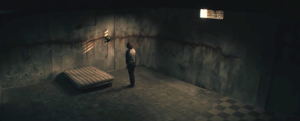 The Black Phone Image of the sixth victim confined to a cement basement
