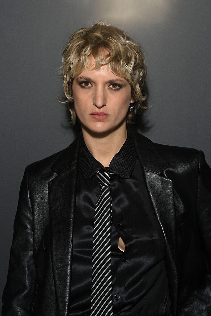 agathe rouselle wearing striped tie and black leather jacket
