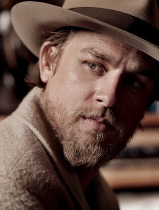 charlie hunnam Wearing a Brown Fedora